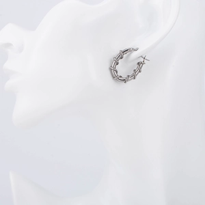 Retro punk titanium steel hoop earrings with thorn vine texture for a trendy urban look