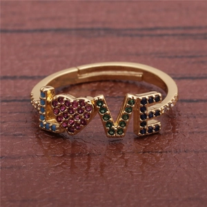 Adjustable gold LOVE ring featuring vibrant micro-pave colored zircon stones