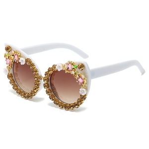 Luxury cat-eye sunglasses with white frame, floral rhinestones, and bee detailings