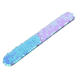 Close-up of a sequined slap bracelet with reversible blue and purple scales