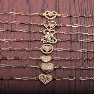 Iced out zircon heart bracelets in gold finish with various hip hop charms