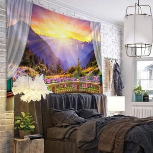 Close-up of scenic landscape tapestry on bedroom wall featuring sunset and mountain views