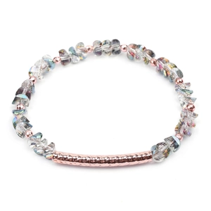 Detail of faceted crystal beads and hammered rose gold tube on a modern handmade bracelet