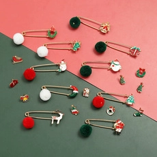 Detail of Christmas enamel pin set featuring Santa, reindeer, and festive textile charms
