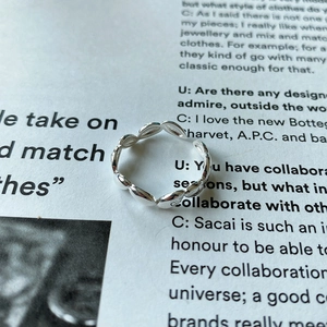 Macro shot of 925 silver open ring with polished leaf pattern texture on magazine