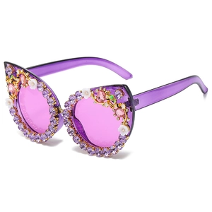 Purple cat-eye sunglasses featuring luxury rhinestone floral and bee embellishments