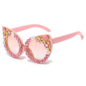 Pink cat eye sunglasses with gradient lenses and luxury rhinestone floral bee decoration