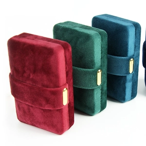 Elegant velvet jewelry organizer boxes with gold metal clasps in assorted colors