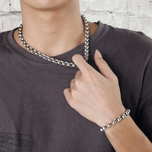 Men's titanium steel 9mm ball chain necklace and bracelet set on male model