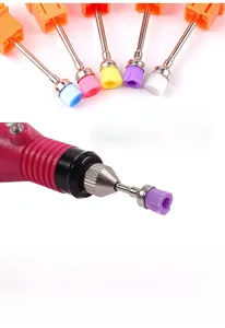Detail of colorful nylon cleaning brushes mounted on a nail drill for dust removal
