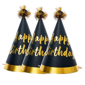 Three black birthday party hats with gold pom-poms and Happy Birthday lettering on white