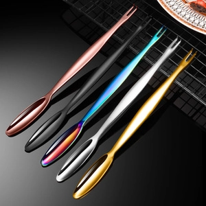Close-up of colorful stainless steel sporks set in rose gold black and gold finish
