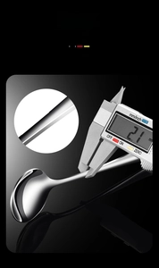 Detail view of 2.1mm thick stainless steel spoon with digital caliper measurement