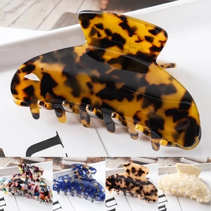 Detailed showcase of diverse patterns including tortoise shell and marbled hair claw clips
