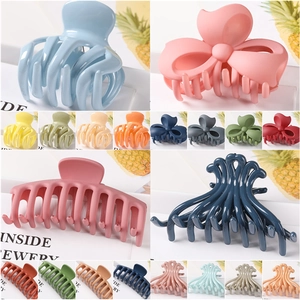 Detailed collage of large matte geometric hair claws in various vibrant candy colors