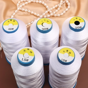 White DIY pearl beading threads in sizes 10-40 displayed on elegant satin fabric