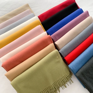 Soft candy-colored cashmere-like scarves with fringe in various solid shades