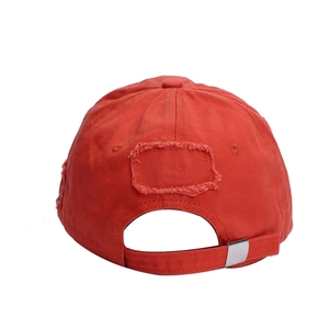 Distressed vintage orange baseball cap with ripped details and metal back closure