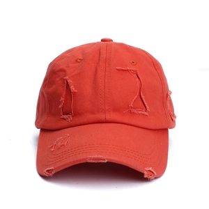 Vintage orange distressed baseball cap with ripped details and curved brim for sun protection