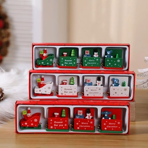 Close-up of wooden Christmas train set with Santa, snowman and gift box decorations
