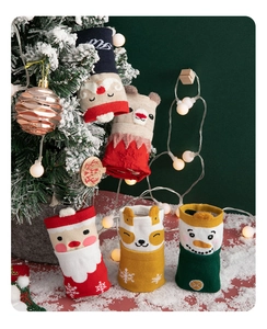 Detailed view of festive Christmas socks featuring 3D cartoon Santa and reindeer designs