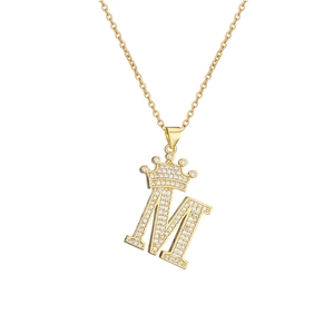 Detail of gold crown initial M pendant with micro-pave cubic zirconia on a fine chain