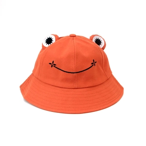 Cute orange cotton frog bucket hat with 3D eyes and embroidered floral smiley face