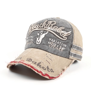 Detail of vintage washed baseball cap with Black Rebel embroidery and distressed edges