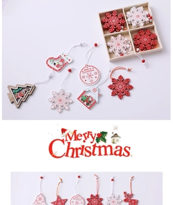 Detailed view of wooden Christmas ornaments set with snowflake and reindeer motifs