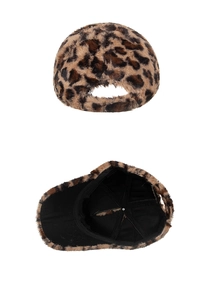 Detail view of leopard print plush baseball cap with fuzzy texture and black inner lining