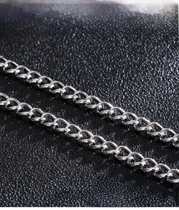 Macro detail of 316L stainless steel chain links with high polished silver finish