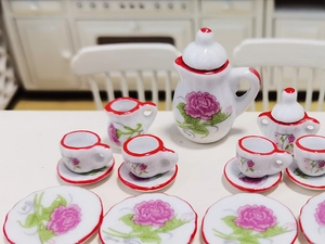 Macro detail of 15pcs miniature ceramic dollhouse tea set with floral rose pattern