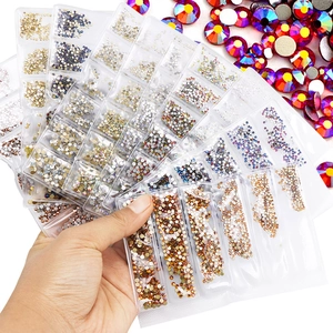 Assorted K9 crystal nail art rhinestones in multi-color grids for DIY manicure decoration