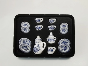 Detailed view of 15-piece miniature ceramic tea set with classic blue floral patterns