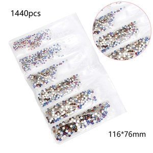 Flat lay of 1440 pieces AB crystal nail rhinestones in a multi-compartment package
