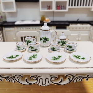 15-piece dollhouse miniature ceramic tea set with green clover pattern and gold trim