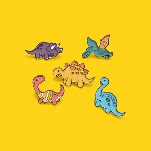 Set of five colorful cartoon dinosaur enamel pins featuring Triceratops and Pterosaur