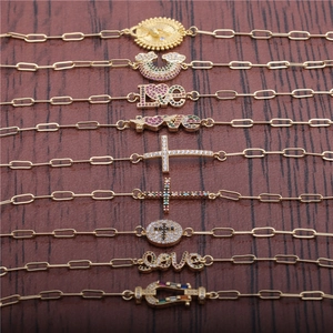 Detail of adjustable gold-plated Cuban chain bracelets with micro-set zircon charms