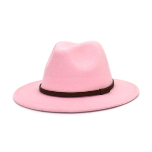 Detail of pink wool fedora hat featuring a brown decorative band and soft felt texture