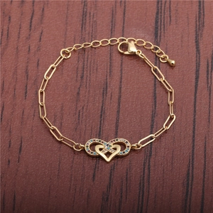 Gold-tone Cuban link bracelet featuring a heart and infinity symbol with multi-color zircons