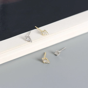 Close-up of S925 sterling silver stud earrings with geometric square zircon in gold and silver