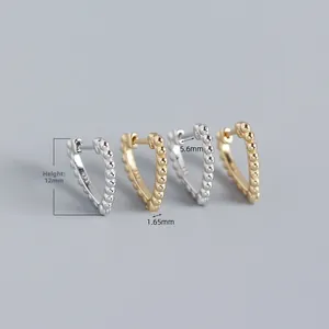 Detailed view of S925 sterling silver heart-shaped hoop earrings with beaded trim
