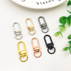 Macro detail of rotating swivel snap hooks for keychains in six premium metallic finishes