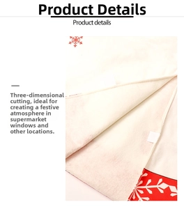 Close-up of ivory Christmas tree skirt featuring red snowflake pattern and velcro fastener
