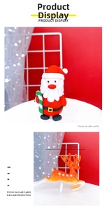 Close-up of Santa Claus and 7.2cm deer cake toppers for Christmas party decorations