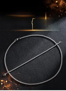 Detailed view of silver wheat chain necklace and bracelet set with lobster clasp