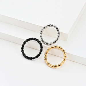 Minimalist twisted rope titanium steel rings set in black, silver, and gold finishes