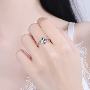 Elegant S925 sterling silver twist ring with a 1ct round moissanite on a female hand