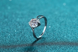 Macro detail of a 1 carat moissanite silver ring featuring sparkling round cut facets