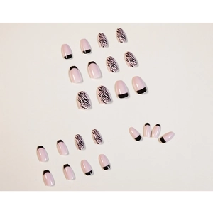 Pink French style press-on nails with black trim and zebra pattern, medium oval shape